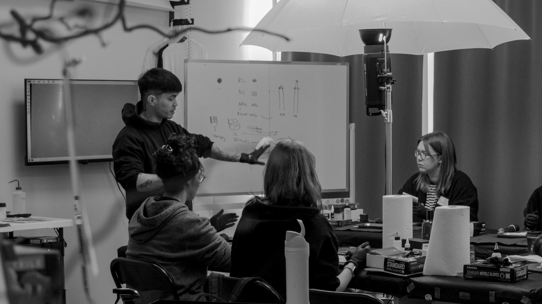 Rye teaching students in the studio